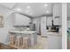 Bright kitchen with granite counters, white cabinetry, and stainless appliances at 3157 Hermitage Dr., Little River, SC 29566