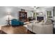 Comfortable living room with hardwood floors, a fireplace, and lots of natural light at 3157 Hermitage Dr., Little River, SC 29566