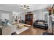 Spacious living room with fireplace, hardwood floors, and ample seating for entertaining guests at 3157 Hermitage Dr., Little River, SC 29566