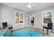 Bright sunroom with ceiling fan, two windows, and comfortable seating at 3157 Hermitage Dr., Little River, SC 29566