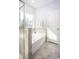 Modern bathroom with a soaking tub and neutral tile at 352 Magnolia Terrace Dr, Myrtle Beach, SC 29579