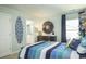 Tastefully decorated bedroom with a fun, beachy theme and a door to the bathroom at 352 Magnolia Terrace Dr, Myrtle Beach, SC 29579