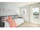 Bright bedroom featuring a daybed with decorative pillows, a window, and neutral walls at 352 Magnolia Terrace Dr, Myrtle Beach, SC 29579