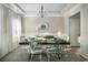 Elegant dining room featuring a large table, stylish chairs, and natural light at 352 Magnolia Terrace Dr, Myrtle Beach, SC 29579