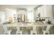 Contemporary kitchen featuring a granite countertop island with seating, stainless steel appliances, and white cabinetry at 352 Magnolia Terrace Dr, Myrtle Beach, SC 29579