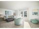 Cozy living room with comfortable seating, shiplap walls, and large windows for natural light at 352 Magnolia Terrace Dr, Myrtle Beach, SC 29579