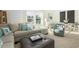 Bright living room featuring stylish decor, shiplap walls, and large windows offering views at 352 Magnolia Terrace Dr, Myrtle Beach, SC 29579