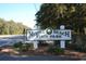Myrtle Beach State Park sign surrounded by lush greenery, inviting visitors to a day of outdoor adventure at 352 Magnolia Terrace Dr, Myrtle Beach, SC 29579