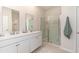 Modern bathroom featuring double sinks, a glass-enclosed shower, and neutral tones for a clean, fresh look at 380 Rookroost Circle, Conway, SC 29526
