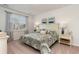 This bedroom features a decorative bedspread, window with natural light, and matching bedside tables at 380 Rookroost Circle, Conway, SC 29526
