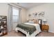 Bright bedroom with modern art, neutral carpet, and a stylish nightstand with a lamp at 380 Rookroost Circle, Conway, SC 29526