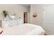 Well-lit bedroom featuring a dresser, decorative mirror, and neutral tones, creating a relaxing atmosphere at 380 Rookroost Circle, Conway, SC 29526