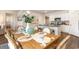Dining area with elegant table setting, views of the kitchen, and modern decor at 380 Rookroost Circle, Conway, SC 29526