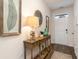 Inviting entryway features stylish decor, a wooden console table, and attractive wood-look flooring at 380 Rookroost Circle, Conway, SC 29526