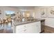 Open concept kitchen boasts granite countertops and island with dining area, perfect for entertaining at 380 Rookroost Circle, Conway, SC 29526