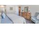 Cozy bedroom featuring a comfortable bed, stylish decor, and an open doorway to the dining room at 384 Rookroost Circle, Conway, SC 29526