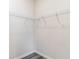 Corner of walk-in closet featuring a corner shelf and wood-look flooring at 384 Rookroost Circle, Conway, SC 29526