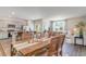 Bright open-concept kitchen, dining and living areas with wood accents and lots of natural light at 384 Rookroost Circle, Conway, SC 29526