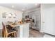 Bright kitchen featuring stainless steel appliances, gray cabinets, a granite island with seating, and modern finishes at 384 Rookroost Circle, Conway, SC 29526