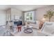 Bright living room with neutral tones, comfortable seating, stylish decor, and a large window at 384 Rookroost Circle, Conway, SC 29526
