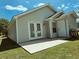Backyard featuring a concrete patio, French doors, a white door and a well-maintained lawn at 3863 Stern Dr., Conway, SC 29526