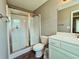 Clean bathroom featuring a glass-enclosed shower, vanity with sink, and mirrored cabinet at 3863 Stern Dr., Conway, SC 29526