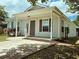 Attractive home with a covered porch, neat landscaping, and a concrete driveway leading up to the entrance at 3863 Stern Dr., Conway, SC 29526