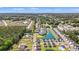 Aerial view of neighborhood homes around ponds in a coastal community with lush trees and landscaping at 3968 Hibiscus Dr., Little River, SC 29566