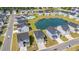 Aerial view of new homes in a residential community with a pond and pool area, showcasing the neighborhood layout at 3968 Hibiscus Dr., Little River, SC 29566