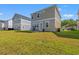 Home featuring a spacious backyard with well-manicured lawn and patio at 3968 Hibiscus Dr., Little River, SC 29566