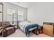 Comfortable bedroom featuring natural light and leather chair at 3968 Hibiscus Dr., Little River, SC 29566