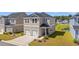 Two story home with front entry two car garage and attractive landscaping at 3968 Hibiscus Dr., Little River, SC 29566