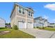 Exterior of two-story homes with attached garages and well-manicured lawns and landscaping at 3968 Hibiscus Dr., Little River, SC 29566