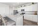 Open kitchen with stainless steel appliances, granite counters, and an island with bar seating at 3968 Hibiscus Dr., Little River, SC 29566
