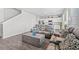 Open concept living area featuring comfortable seating, wood flooring, and white walls at 3968 Hibiscus Dr., Little River, SC 29566
