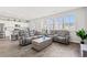 Comfortable living room featuring two sofas, wood flooring, and plenty of natural light at 3968 Hibiscus Dr., Little River, SC 29566