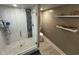 This bathroom showcases a glass shower with decorative tile and pebble floor at 417 South Dunes Dr. # B16, Pawleys Island, SC 29585