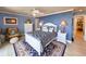 Comfortable bedroom features a bed with a decorative rug and a matching ceiling fan at 417 South Dunes Dr. # B16, Pawleys Island, SC 29585