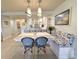 Charming dining area features a built-in bench with colorful cushions, and unique pendant lighting at 417 South Dunes Dr. # B16, Pawleys Island, SC 29585