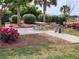 Exterior picnic area with a table, grill, and lush landscaping at 417 South Dunes Dr. # B16, Pawleys Island, SC 29585
