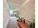 Bright hallway with a comfortable bench, decorative pillows, and a glimpse of the outdoors at 417 South Dunes Dr. # B16, Pawleys Island, SC 29585