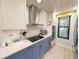 Updated kitchen boasts custom cabinets, stainless steel appliances, and a window with a view at 417 South Dunes Dr. # B16, Pawleys Island, SC 29585
