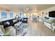 Inviting living room with stylish furniture, decorative rug, and seamless transition to dining area at 417 South Dunes Dr. # B16, Pawleys Island, SC 29585