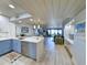 Open-concept living room with modern lighting, hardwood floors, and access to a balcony at 417 South Dunes Dr. # B16, Pawleys Island, SC 29585