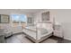 Well-lit bedroom showcases a four-poster bed, large window and stylish decor with calm aesthetics at 418 Glade Ct., Loris, SC 29569