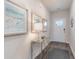 Inviting entryway featuring decorative artwork, a mirrored table, and stylish flooring for a warm welcome at 418 Glade Ct., Loris, SC 29569