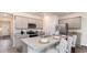 Modern kitchen featuring sleek cabinets, granite countertops, and stainless steel appliances for culinary enthusiasts at 418 Glade Ct., Loris, SC 29569