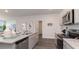 Contemporary kitchen featuring granite countertops, stainless appliances, and wood flooring, perfect for entertaining at 418 Glade Ct., Loris, SC 29569