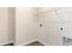 Bright laundry room with washer/dryer hookups and shelving, ready for customization at 418 Glade Ct., Loris, SC 29569