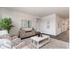 Bright living room featuring modern decor, patterned wallpaper, neutral colors, and stylish furniture at 418 Glade Ct., Loris, SC 29569